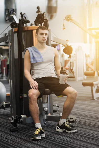 Man exercising on gym machine