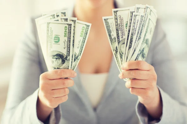 Close up of woman hands holding us dollar money