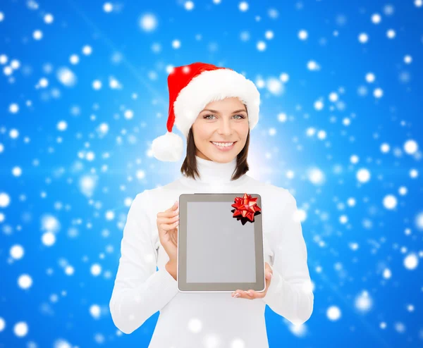 Woman in santa helper hat with tablet pc