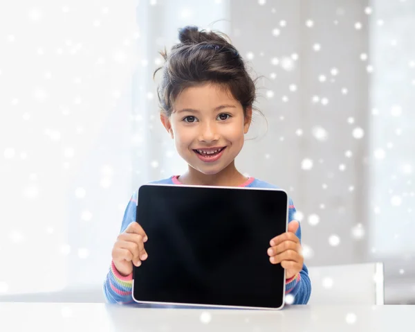 Smiling girl with tablet pc at home