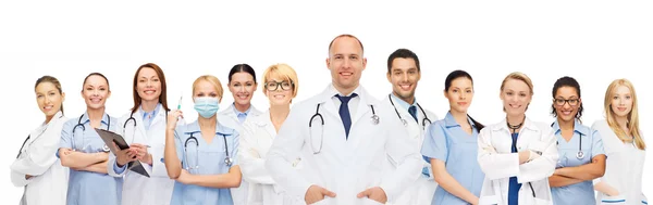 Group of smiling doctors with clipboard