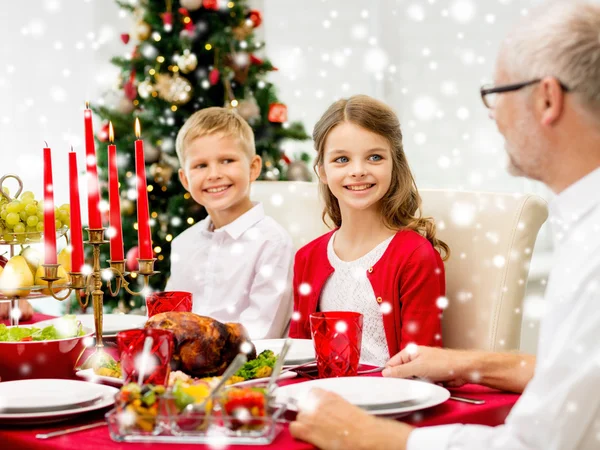 Smiling family having holiday dinner at home