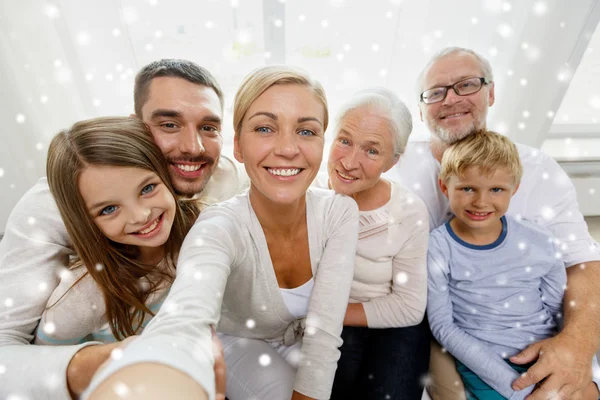 Happy family taking selfie at home