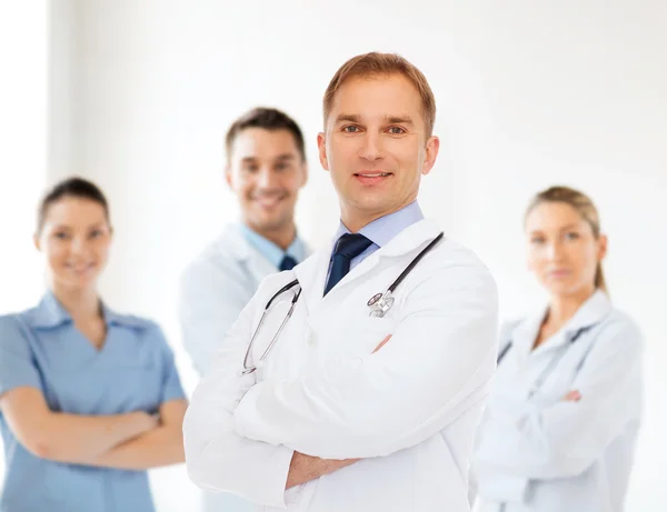 Smiling male doctor with stethoscope