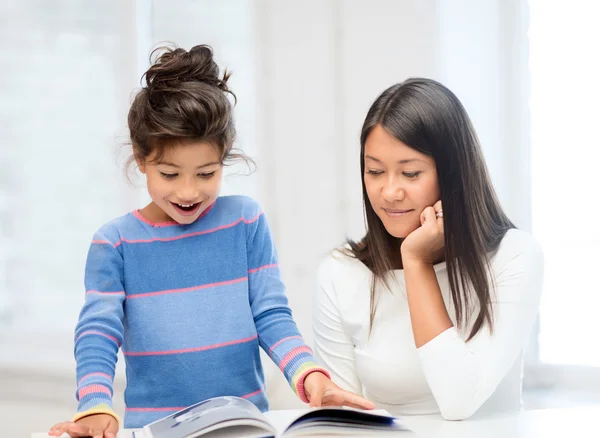 Mother and daughter with book