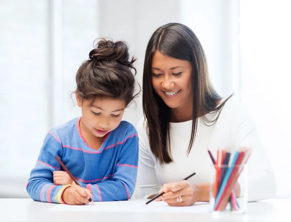 Mother and daughter drawing