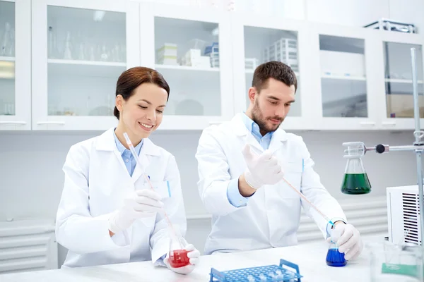 Young scientists making test or research in lab