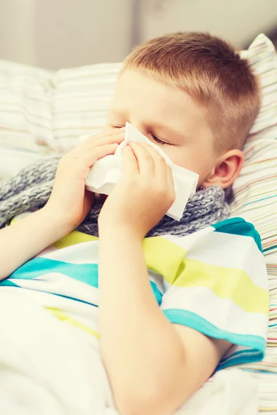 Ill boy with flu at home