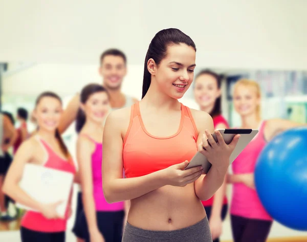 Sporty woman with tablet pc computer