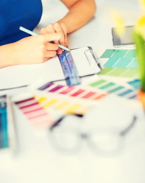Woman working with color samples for selection