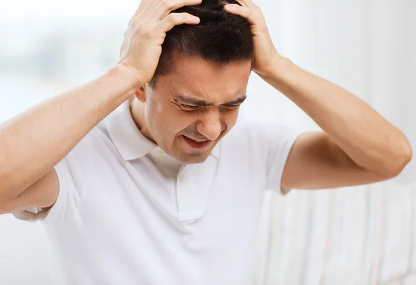 Man suffering from head ache