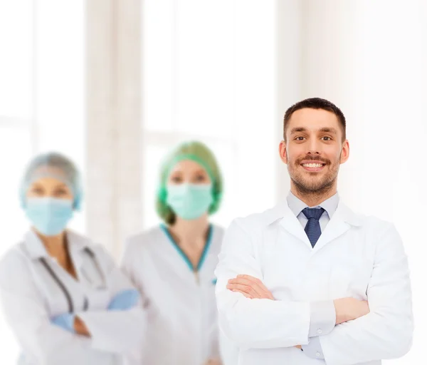 Smiling male doctor in white coat