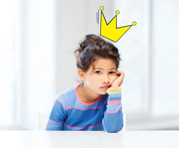 Bored little girl with crown doodle over head