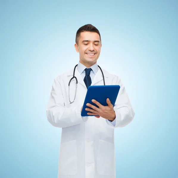Smiling male doctor in white coat with tablet pc