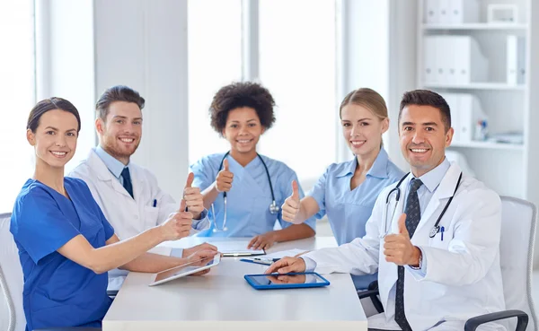 Group of happy doctors meeting at hospital office