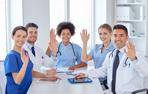 Group of happy doctors meeting at hospital office