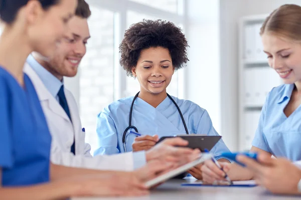 Group of happy doctors meeting at hospital office