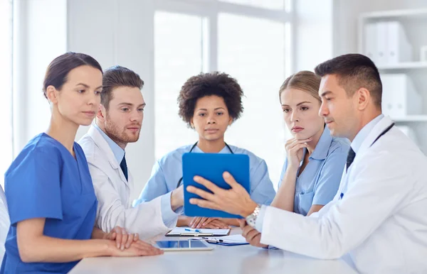 Group of happy doctors meeting at hospital office