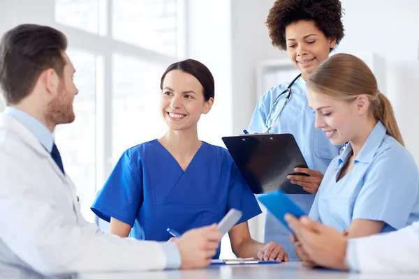 Group of happy doctors meeting at hospital office