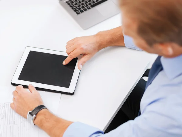 Businessman with tablet pc in office