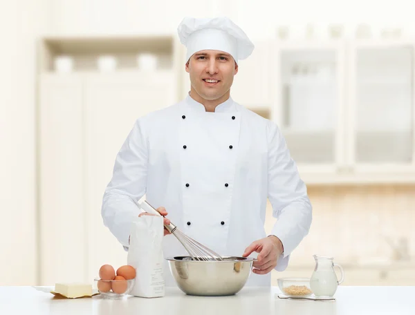 Happy male chef cook baking