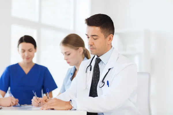 Group of happy doctors meeting at hospital office