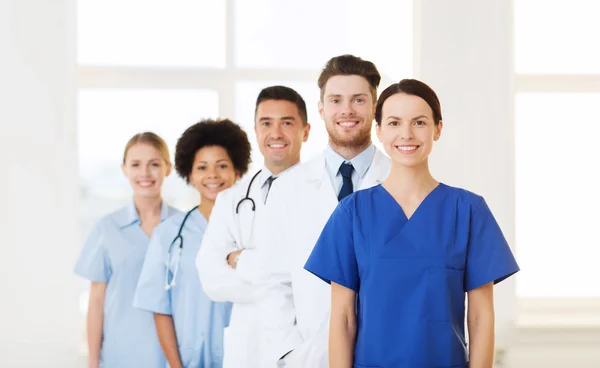 Group of happy doctors at hospital