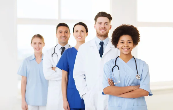 Group of happy doctors at hospital