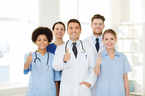 Group of happy doctors at hospital