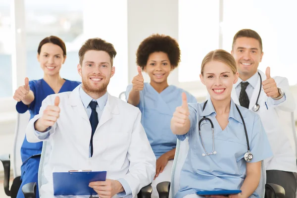 Group of happy doctors on seminar at hospital