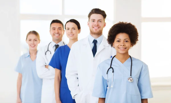 Group of happy doctors at hospital