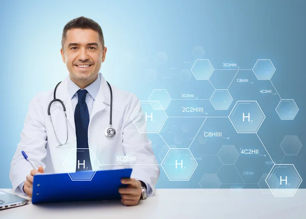 Happy doctor with clipboard over blue background