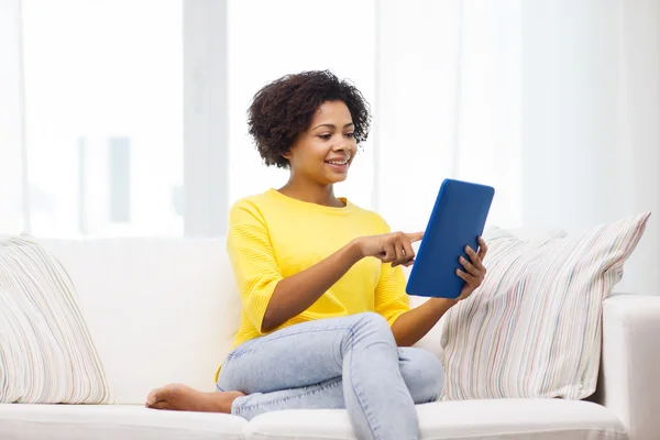 Happy african american woman with tablet pc