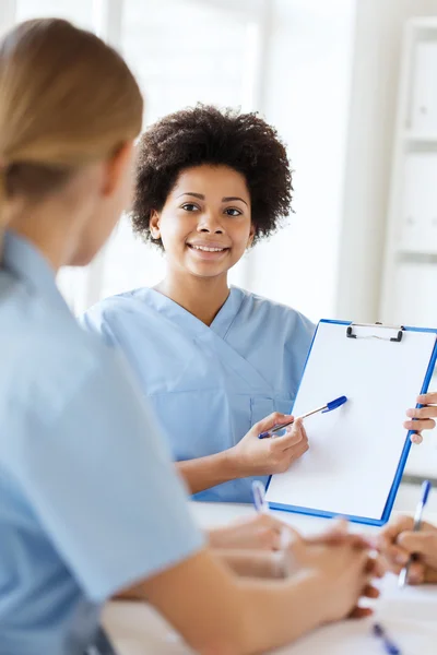 Group of happy doctors meeting at hospital office