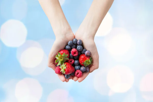 Close up of woman hands holding berries