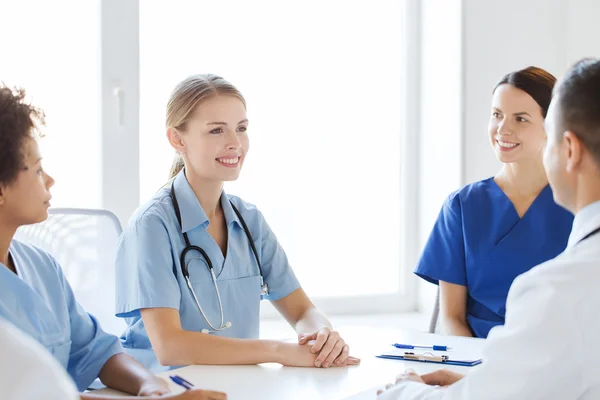 Group of happy doctors meeting at hospital office