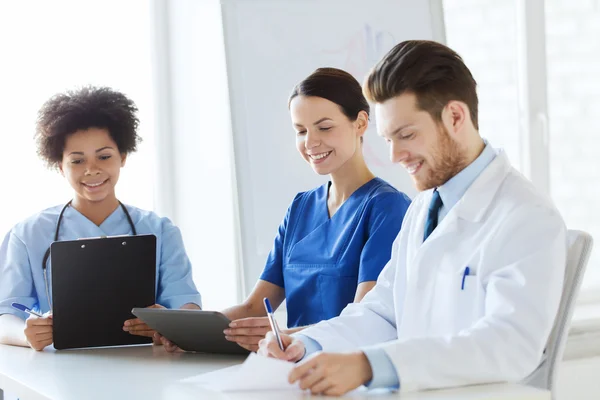 Group of happy doctors meeting at hospital office