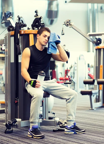 Man exercising on gym machine