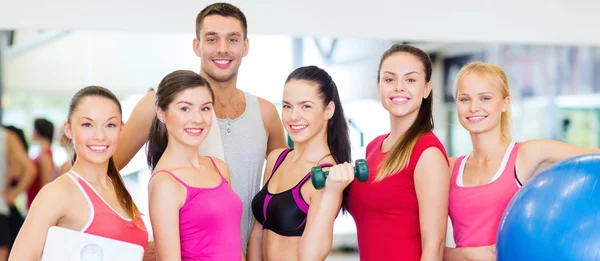 Group of smiling people in the gym