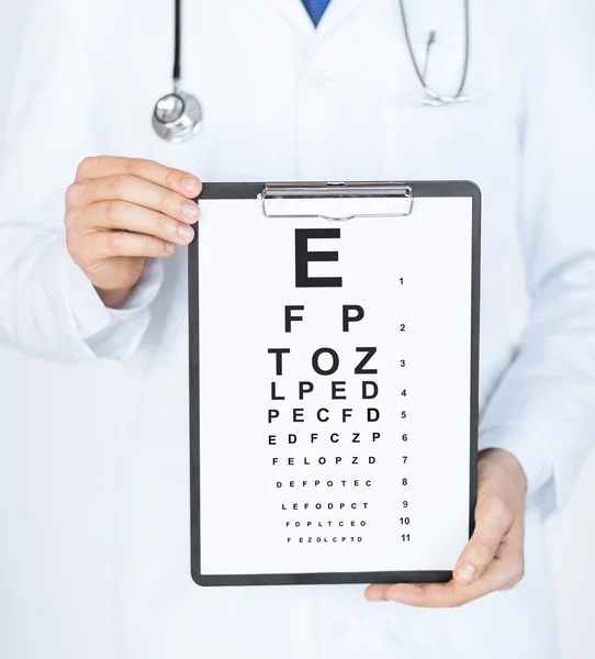 Male ophthalmologist with eye chart