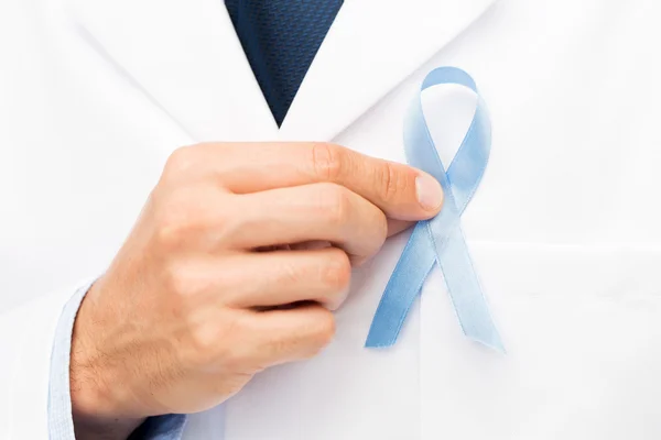 Doctor hand with prostate cancer awareness ribbon