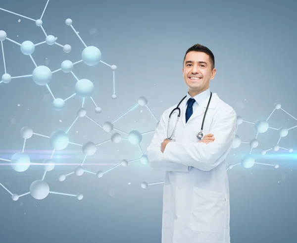 Smiling male doctor over molecule formula