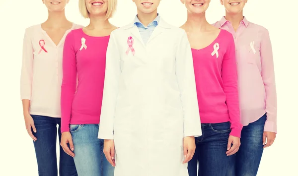 Close up of women with cancer awareness ribbons