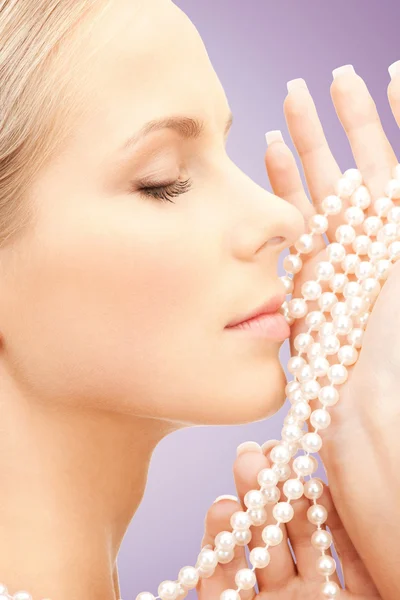 Beautiful woman with sea pearls beads