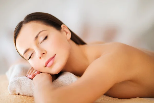 Beautiful woman with closed eyes in spa