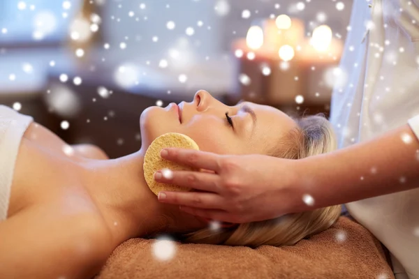 Close up of woman having face massage in spa salon