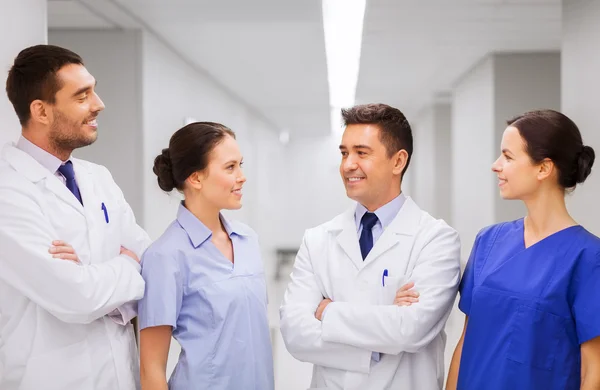 Happy group of medics or doctors at hospital