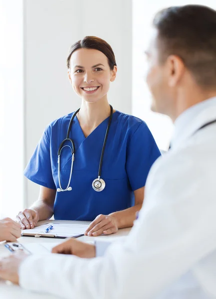 Group of happy doctors meeting at hospital office