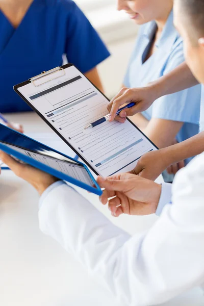 Close up of doctors with clipboard at hospital