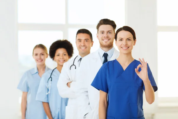 Group of happy doctors at hospital